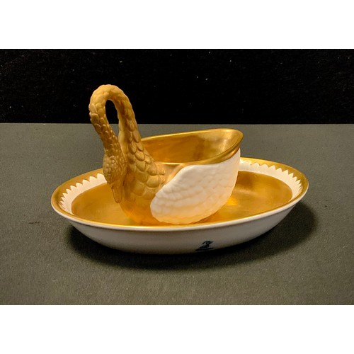 5 - A Dresden oval cup and saucer, the cup formed as a swan with a curling neck forming the handle, deco... 
