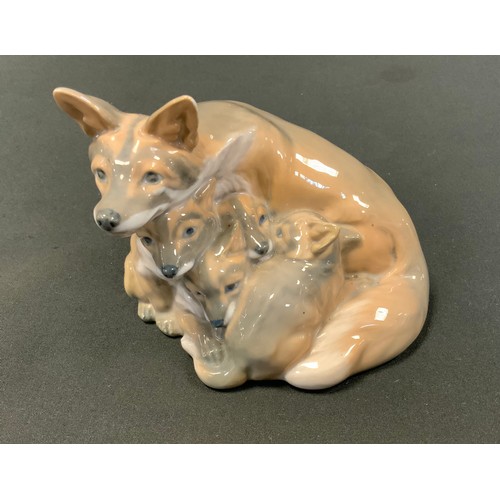 8 - A Royal Copenhagen figure group of mother and pups, mark to base, 10cm high