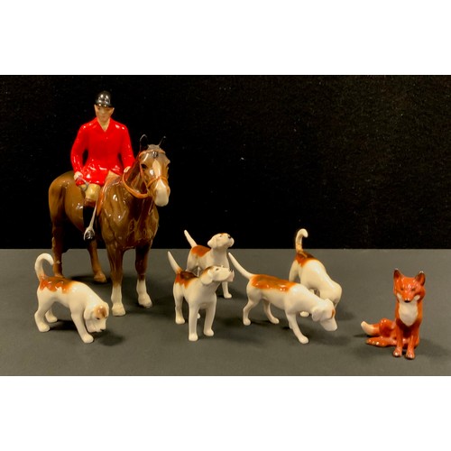 19 - Beswick Huntswoman up on brown gloss horse, conforming five hounds and a fox (7)