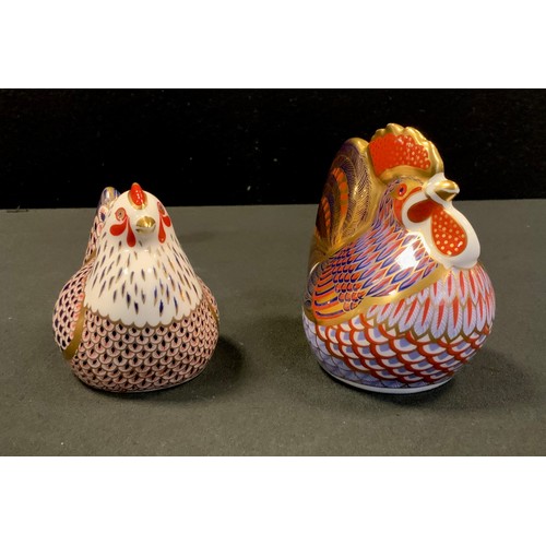 25 - Royal Crown Derby Paperweights - Cockerel gold stopper; Hen silver stopper (2).