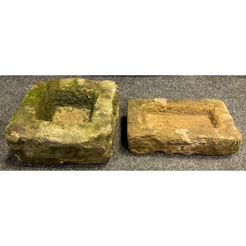 29 - A small Derbyshire gritstone trough, 17cm high x 34cm x 31cm;  another, smaller trough, (2).