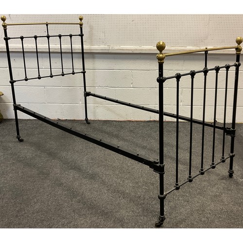 32 - A Victorian cast iron and brass single bed frame.