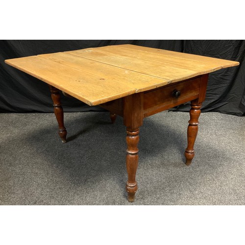 65 - A 19th century rustic pine-top Pembroke style kitchen table, five-plank top, on a mahogany base with... 