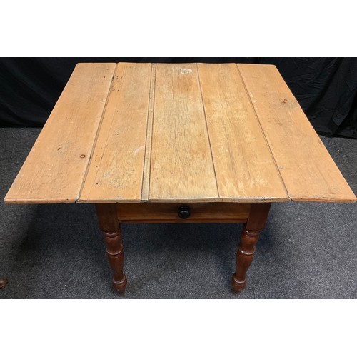 65 - A 19th century rustic pine-top Pembroke style kitchen table, five-plank top, on a mahogany base with... 