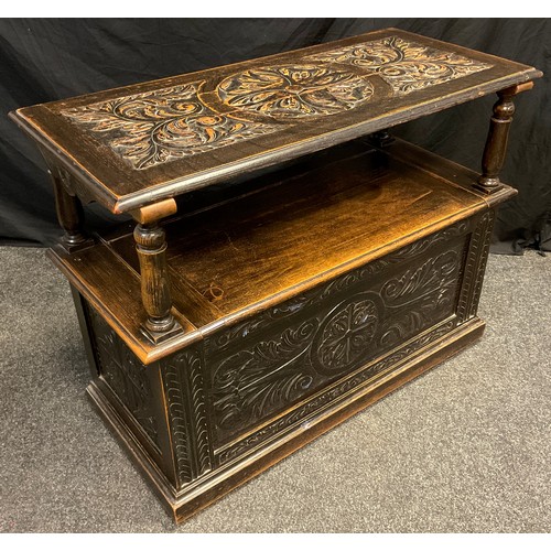 76 - An early 20th century carved oak Monk’s bench, 102cm (81.5cm) high x 106.5cm wide x 47cm deep.