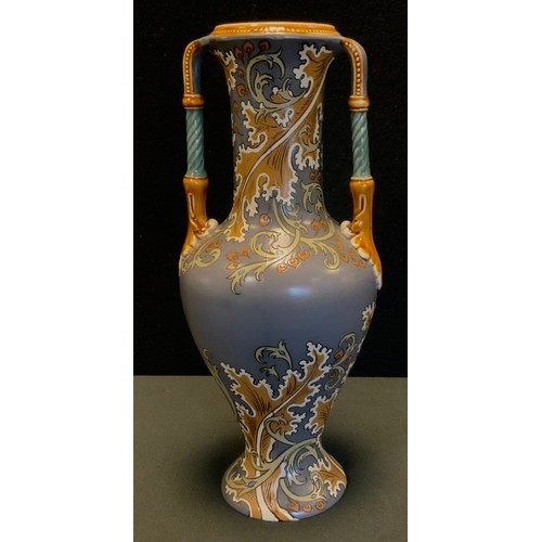 89 - A Mettlach baluster two handled vase decorated with foliate scrolls in ochre, on a grey ground, impr... 