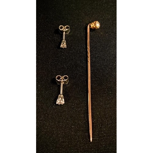 417 - A diamond tipped Tie pin, old brilliant cut, approx. 0.25ct, spiralled rose metal shaft, 1.1g gross,... 