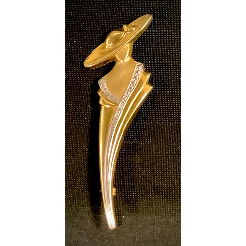 421 - A 9ct gold brooch, as a lady of Fashion, stamped 9ct, 7.2cm long, 3.6g gross