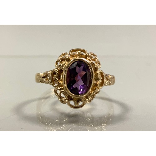 442 - An oval amethyst dress ring, scrolling heart and rope twist mount, 9ct gold shank, size O, 3.5g gros... 