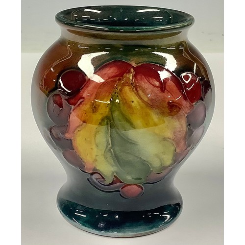 37 - A Moorcroft Flambe Leaf & Berry pattern ovoid vase, 8cm high, impressed marks