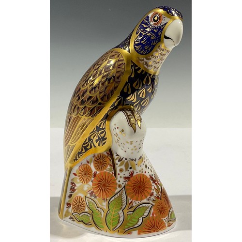56 - A Royal Crown Derby paperweight, Bronze Winged Parrot, gold stopper, boxed