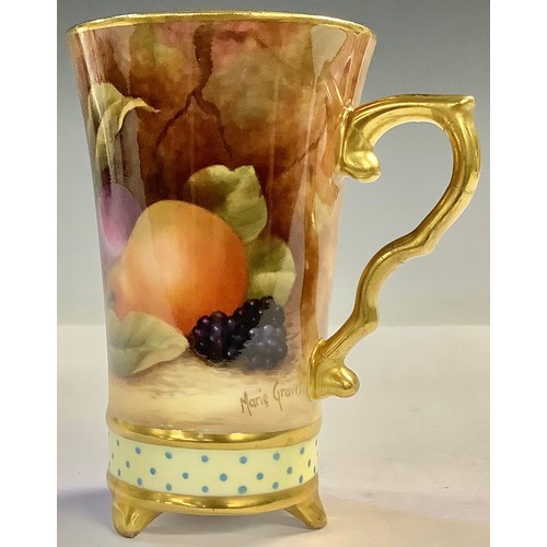 79 - A beaker cup, painted with still life fruit, signed Marie Graves