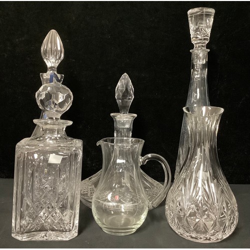 177 - Glass - four cut glass decanters with stoppers; two jugs