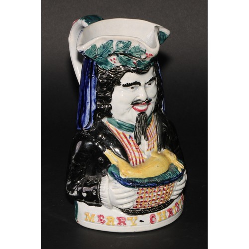 188 - A Staffordshire pearlware novelty toby jug, Merry Christmas, modelled as a bearded figure holding a ... 