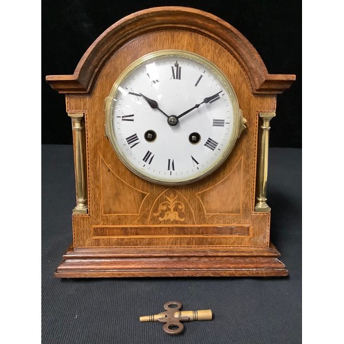 235 - An Edwardian oak and marquetry classical revival mantle clock, 8-day movement striking on a gong, c.... 