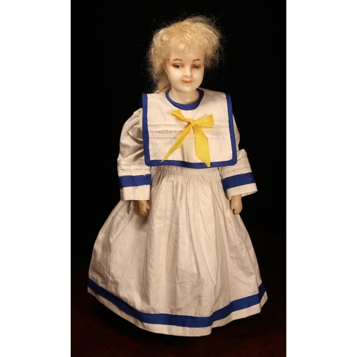 258 - A late 19th century poured wax shoulder head doll, the poured wax shoulder head with painted feature... 