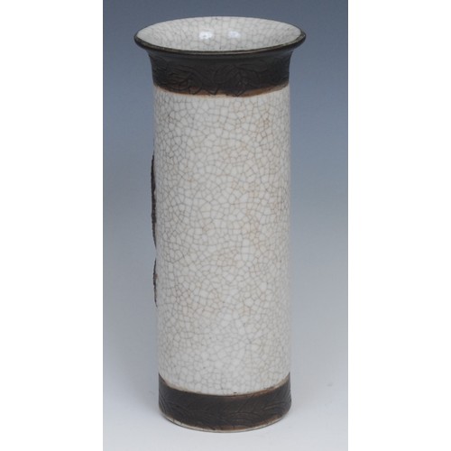 283 - A Chinese sleeve vase, moulded with a dragon, picked out in tones of brown on a crackle glazed groun... 