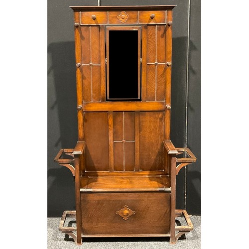 102 - An early to mid-20th century oak hall stand, hinged seat, 182.5cm high, 108cm wide, 32.5cm deep