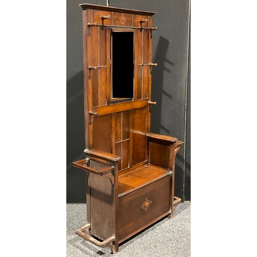 102 - An early to mid-20th century oak hall stand, hinged seat, 182.5cm high, 108cm wide, 32.5cm deep