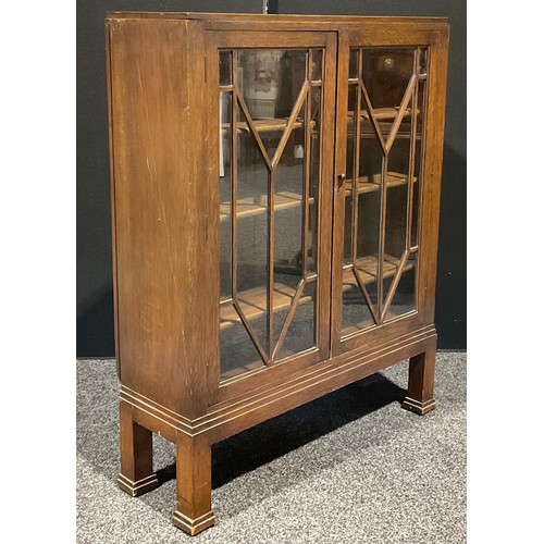 111 - An Art Deco oak bookcase, 114.5cm high, 94cm wide, 29cm deep, c.1940