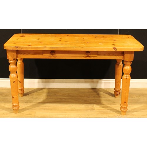 207 - A pine farmhouse kitchen table, 75.5cm high, 137cm wide, 67cm deep