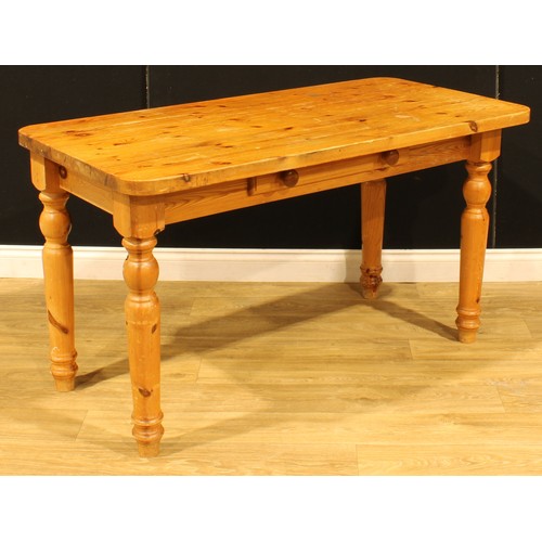 207 - A pine farmhouse kitchen table, 75.5cm high, 137cm wide, 67cm deep