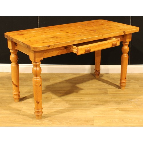 207 - A pine farmhouse kitchen table, 75.5cm high, 137cm wide, 67cm deep