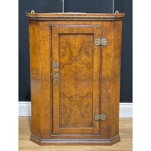 210 - An 18th century walnut wall hanging corner cupboard