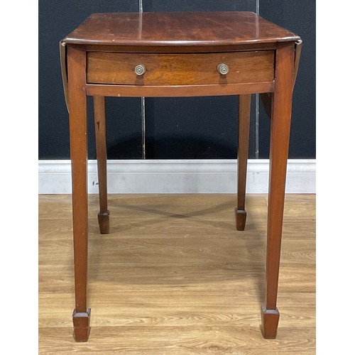 212 - A 19th century mahogany oval Pembroke table