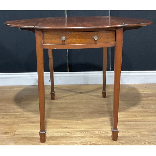 212 - A 19th century mahogany oval Pembroke table