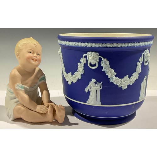 385 - A Wedgwood Jasperware jardiniere; a bisque piano baby