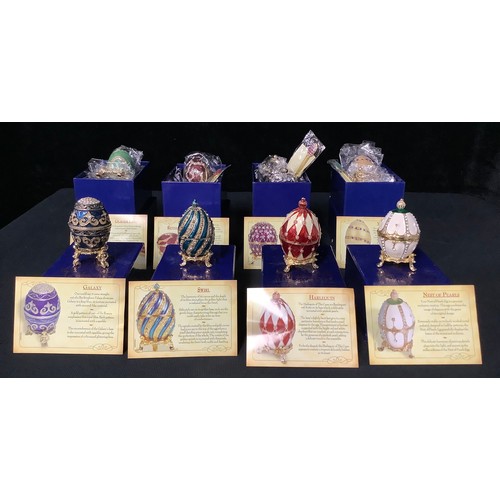 396 - A collection of Atlas Editions The Origins of Faberge Eggs, each boxed (8)