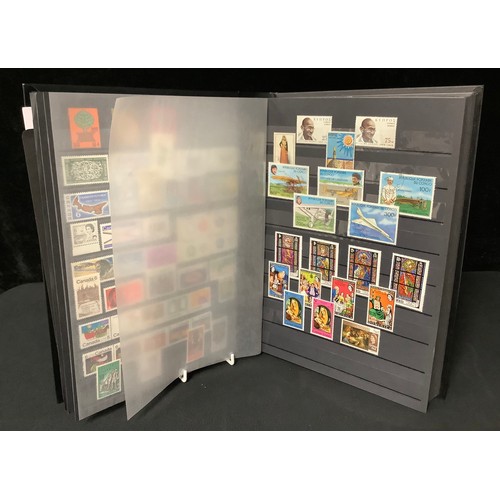 415 - Stamps - large black stockbook, nice GB mint selection 1924 - 1997 at rear, including blocks 4 GVI d... 