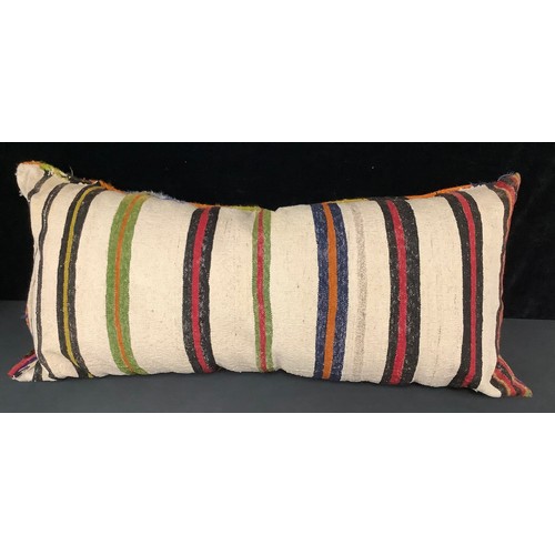 436 - A Middle Eastern woollen floor cushion, 110cm long