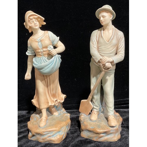 438 - A pair of Continental porcelain figures, Farm Girl and Boy, after Schoop, 35cm high