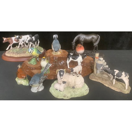 439 - A collection of Beswick bird models, on stand; a Beswick model, of a calf; a Border Fine Arts model,... 