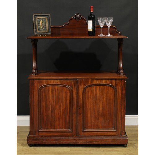 110A - A Victorian mahogany serving buffet, shaped cresting, pierced and carved end supports, the base with... 