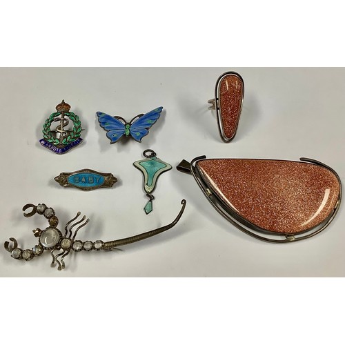 472 - A sterling silver and engine turned enamel butterfly brooch, 4cm wide; a silver and enamel 