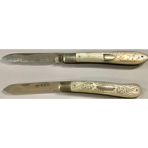 474 - A silver and mother of pearl folding fruit knife, vacant cartouche; another similar (2)