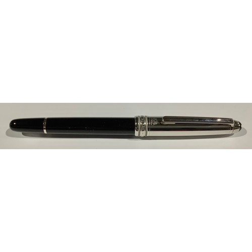 509 - A Montblanc Meisterstuck Fountain Pen with black resin barrel and white metal cap, clip and banding,... 