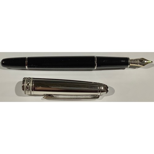 509 - A Montblanc Meisterstuck Fountain Pen with black resin barrel and white metal cap, clip and banding,... 