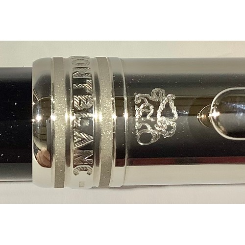 509 - A Montblanc Meisterstuck Fountain Pen with black resin barrel and white metal cap, clip and banding,... 