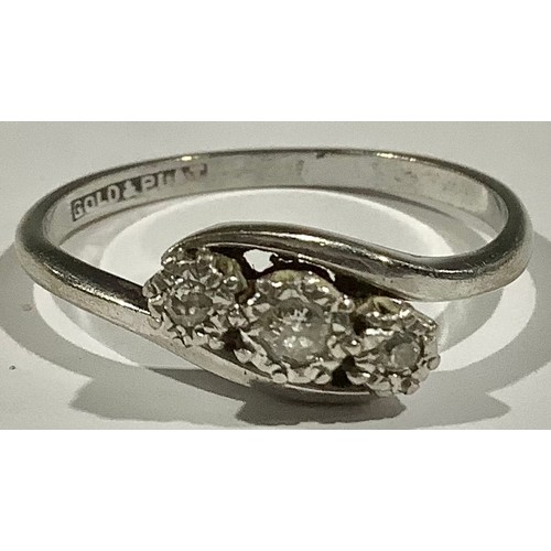 537 - A three stone diamond ring, set in platinum white gold shank, 2.2g