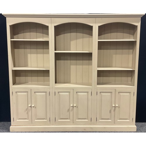 215A - A large contemporary painted pine library bookcase, 199cm high, 225.5cm wide, 34.5cm deep