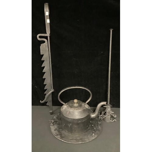 556 - A cast iron jack, with hanging pan and kettle