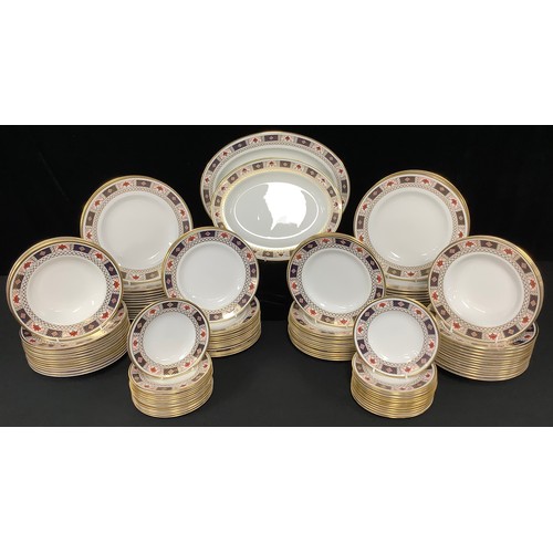 558 - A large Royal Crown Derby dinner service, Derby Border pattern, comprising two oval serving platters... 