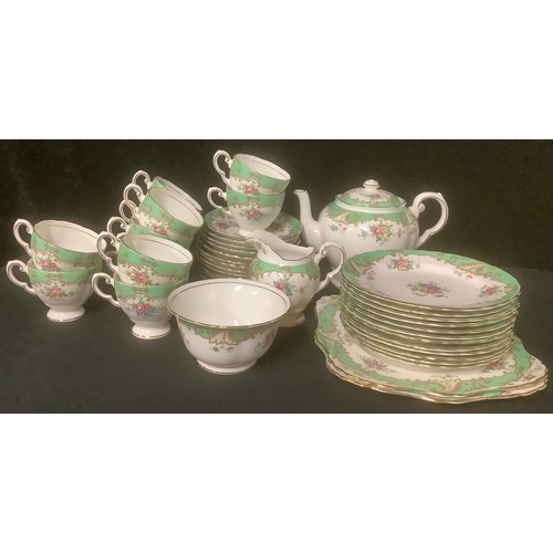 559 - A Tuscan China Plant tea set for twelve, comprising tea cups, saucers, tea pot, sugar bowl, milk jug... 