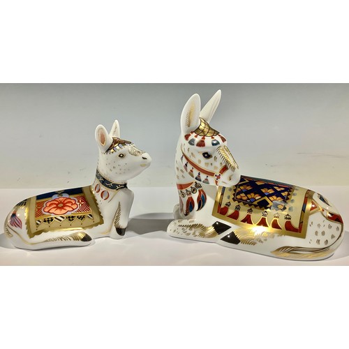 55A - A pair of Royal Crown Derby paperweights, Donkey and Foal, silver stoppers