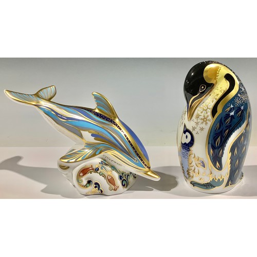 60A - A Royal Crown Derby paperweight, Penguin and Chick, silver stopper; another, Dolphin, silver stopper... 