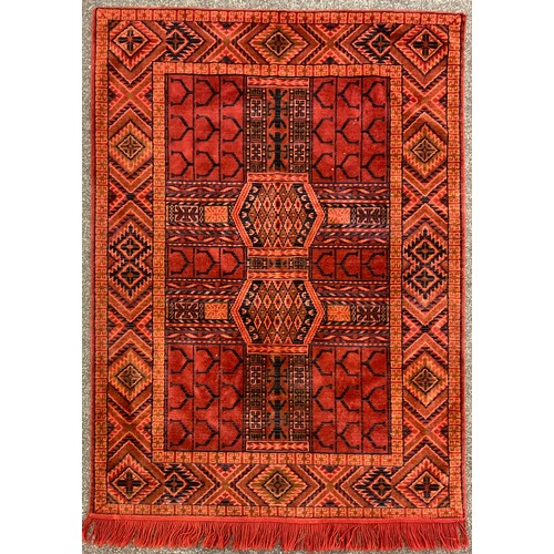 48 - A North African hand-knotted rug, in tones of brown and cream, narrow ochre yellow coloured margin, ... 